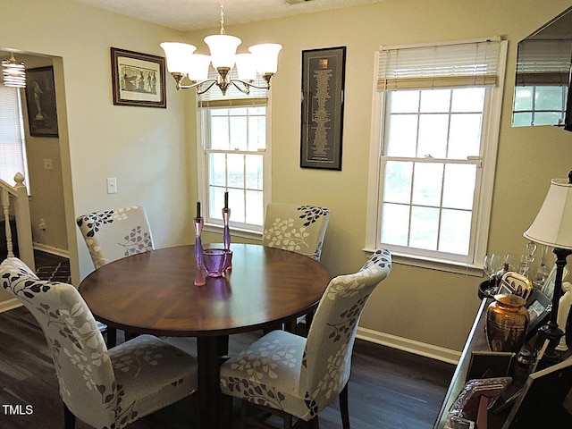 8 Woodsprite Ct, Durham, NC 27703 - dining area with dark wood-type flooring, a chandelier, and baseboards