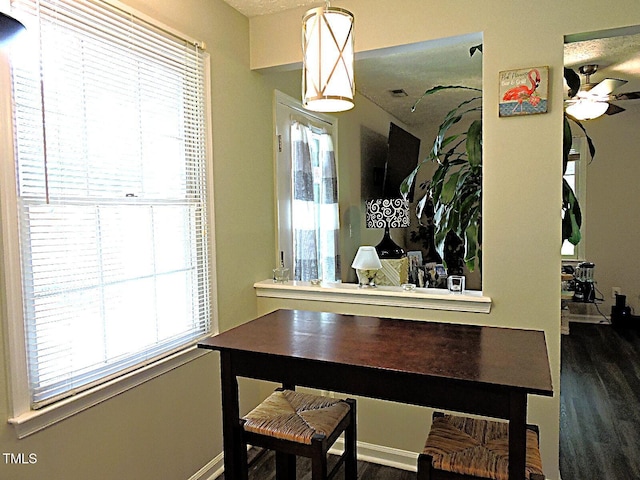 8 Woodsprite Ct, Durham, NC 27703 - dining space with dark wood-style flooring and a ceiling fan