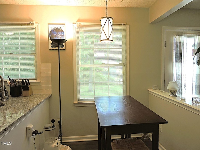 8 Woodsprite Ct, Durham, NC 27703 - dining room featuring healthy amount of natural light and baseboards