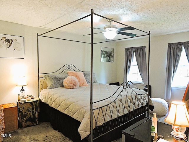 8 Woodsprite Ct, Durham, NC 27703 - bedroom featuring carpet floors, a ceiling fan, and a textured ceiling