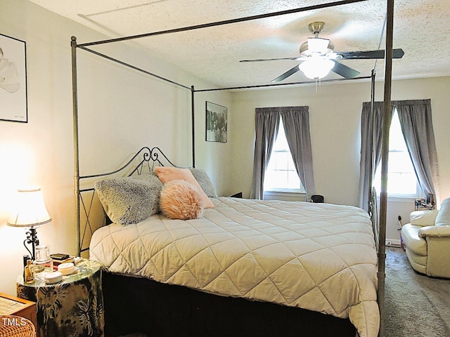 8 Woodsprite Ct, Durham, NC 27703 - carpeted bedroom with multiple windows, a textured ceiling, and ceiling fan