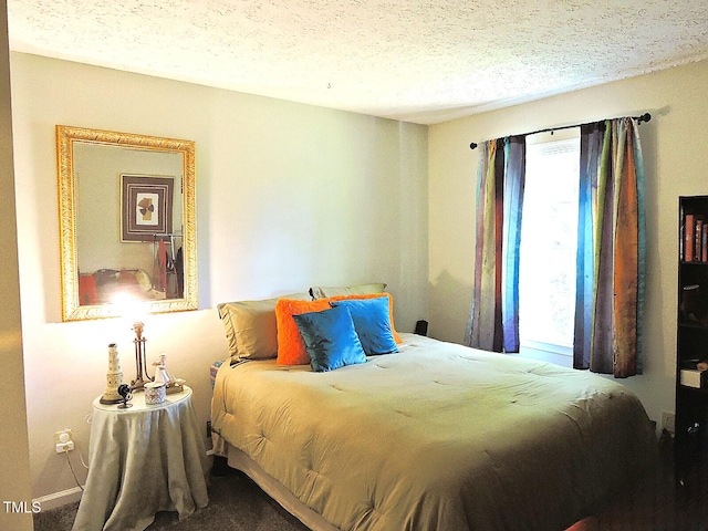 8 Woodsprite Ct, Durham, NC 27703 - bedroom with a textured ceiling and carpet