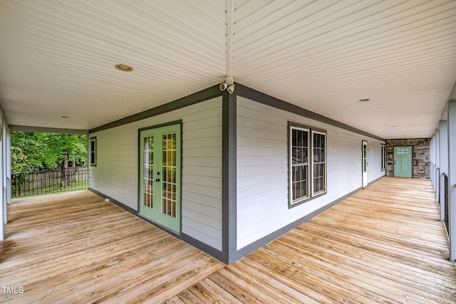 wooden deck featuring french doors