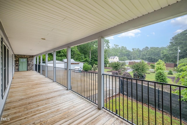 wooden deck featuring view of wooded area