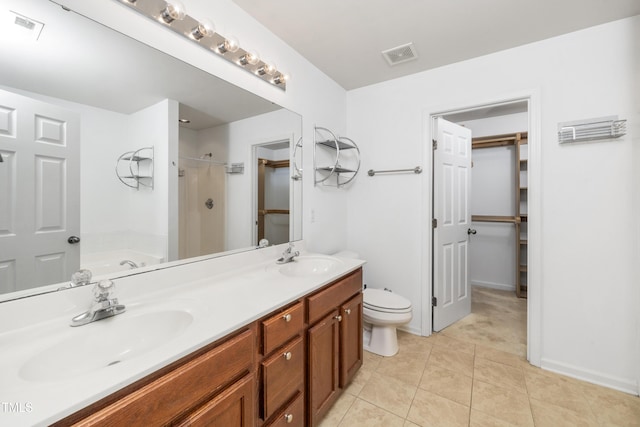 bathroom featuring a shower, tile patterned floors, toilet, double vanity, and a tub