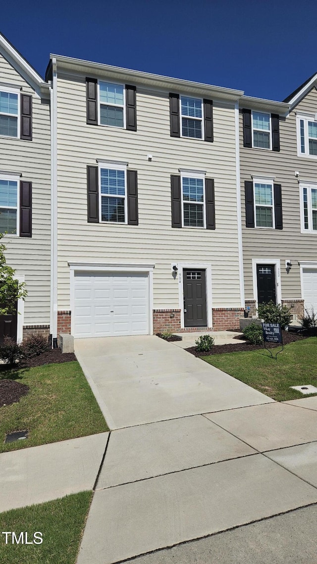 904 Romeria Dr, Durham, NC 27713 - townhome / multi-family property with concrete driveway and a garage