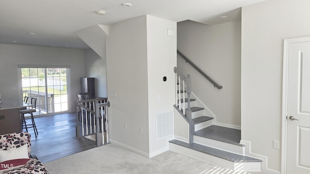 904 Romeria Dr, Durham, NC 27713 - staircase with baseboards and carpet