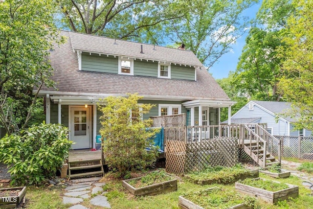 1314 Glendale Ave, Durham, NC 27701 - view of front of house with a garden, roof with shingles, a deck, and fence