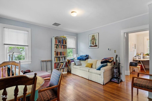 1314 Glendale Ave, Durham, NC 27701 - living room with plenty of natural light, wood finished floors, and crown molding