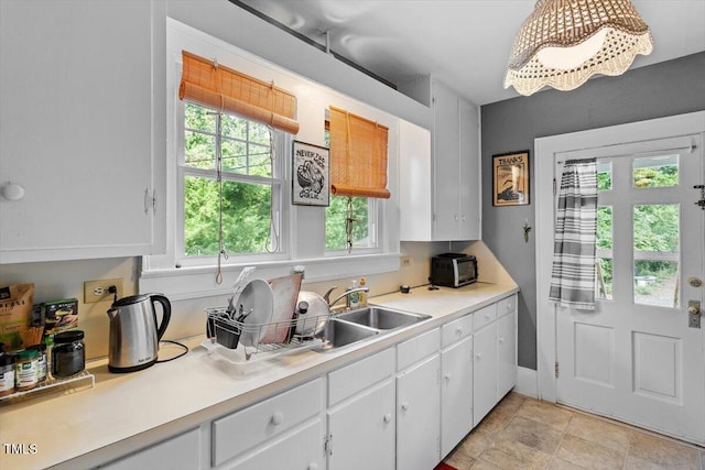 1314 Glendale Ave, Durham, NC 27701 - kitchen with healthy amount of natural light, a sink, and light countertops