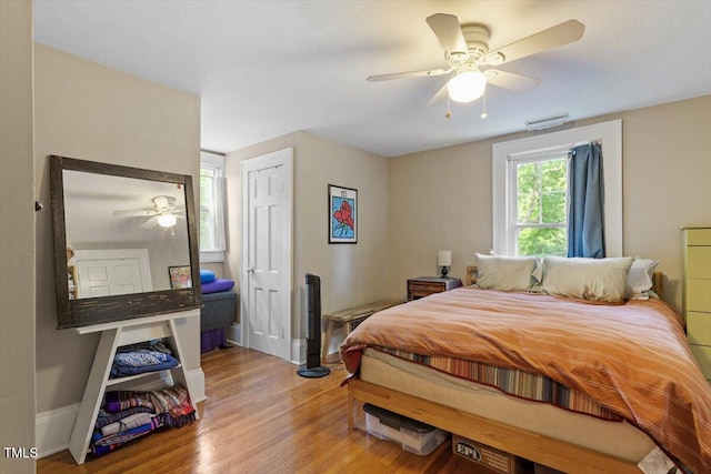 1314 Glendale Ave, Durham, NC 27701 - bedroom featuring wood finished floors, a ceiling fan, baseboards, and a closet