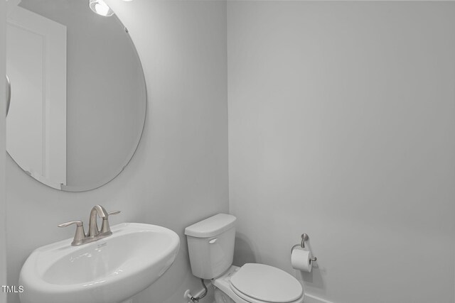 248 Ashford Dr, Pittsboro, NC 27312 - half bath featuring a sink and toilet