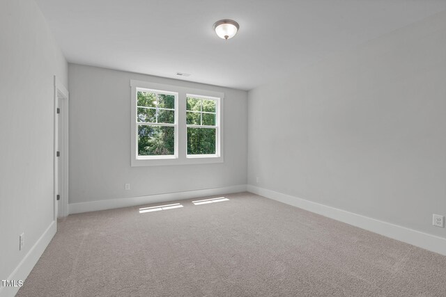 248 Ashford Dr, Pittsboro, NC 27312 - carpeted empty room featuring baseboards