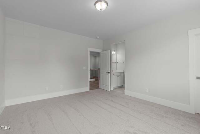 248 Ashford Dr, Pittsboro, NC 27312 - unfurnished bedroom featuring carpet flooring, baseboards, and connected bathroom