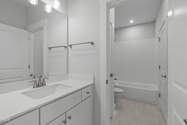 248 Ashford Dr, Pittsboro, NC 27312 - bathroom featuring toilet, vanity, shower / bathtub combination, and recessed lighting