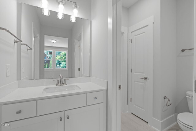 248 Ashford Dr, Pittsboro, NC 27312 - bathroom featuring toilet and vanity