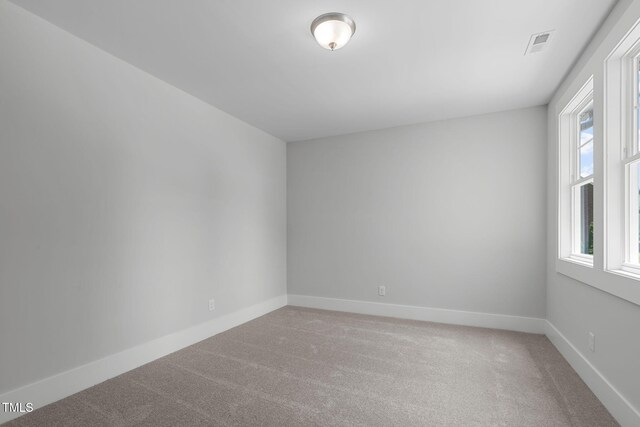 248 Ashford Dr, Pittsboro, NC 27312 - empty room with light colored carpet and baseboards