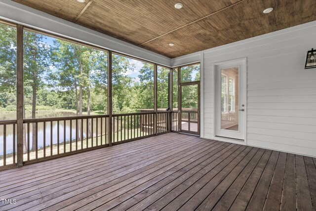 248 Ashford Dr, Pittsboro, NC 27312 - unfurnished sunroom featuring view of scattered trees and a water view