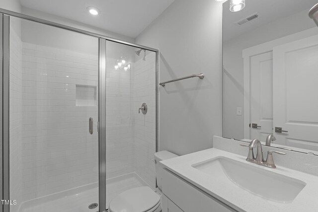 248 Ashford Dr, Pittsboro, NC 27312 - bathroom with a stall shower, toilet, vanity, and recessed lighting
