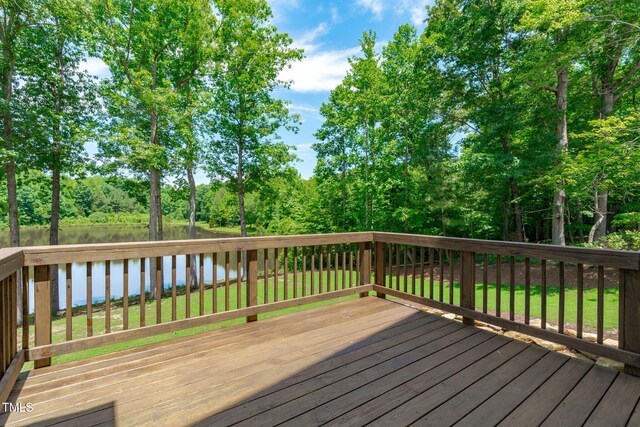 248 Ashford Dr, Pittsboro, NC 27312 - wooden terrace with a water view, a lawn, and view of scattered trees