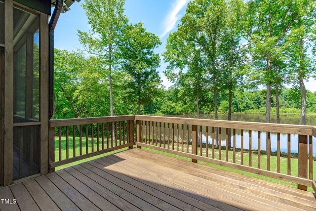 248 Ashford Dr, Pittsboro, NC 27312 - deck with a water view and view of scattered trees