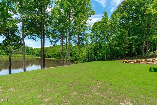 248 Ashford Dr, Pittsboro, NC 27312 - view of grassy yard featuring a water view