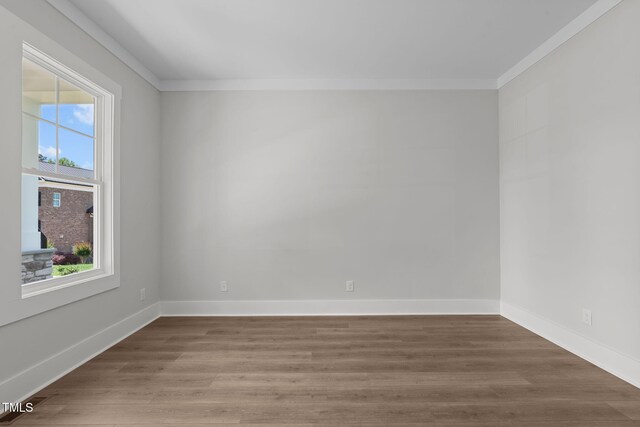 248 Ashford Dr, Pittsboro, NC 27312 - unfurnished room with ornamental molding, healthy amount of natural light, wood finished floors, and baseboards