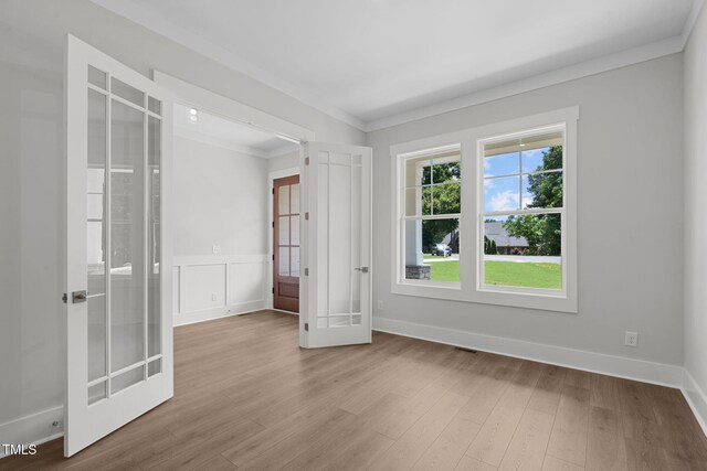 248 Ashford Dr, Pittsboro, NC 27312 - spare room with french doors, ornamental molding, wood finished floors, and baseboards