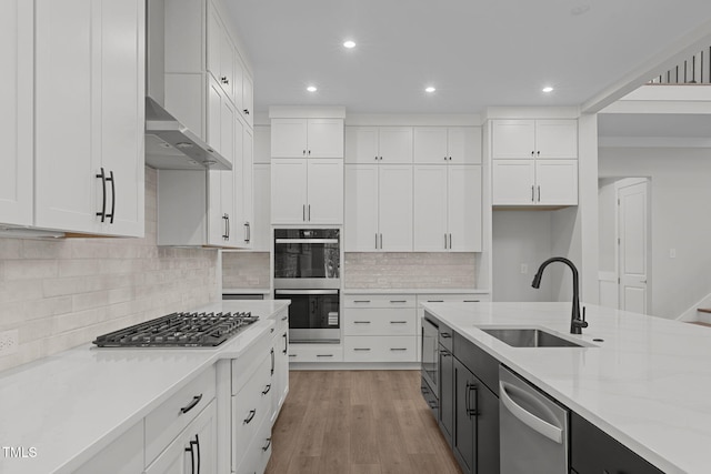 248 Ashford Dr, Pittsboro, NC 27312 - kitchen featuring a sink, appliances with stainless steel finishes, white cabinetry, recessed lighting, and light stone countertops