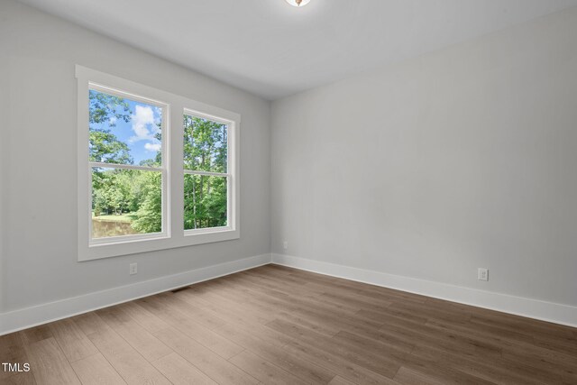 248 Ashford Dr, Pittsboro, NC 27312 - unfurnished room with wood finished floors and baseboards