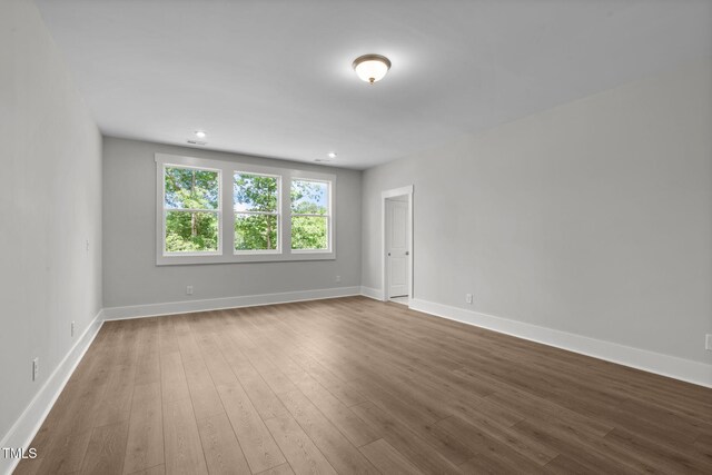 248 Ashford Dr, Pittsboro, NC 27312 - spare room with dark wood-style flooring, baseboards, and recessed lighting