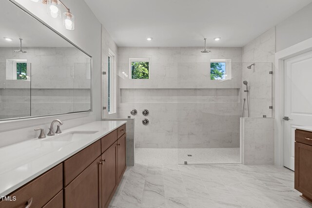 248 Ashford Dr, Pittsboro, NC 27312 - bathroom featuring a walk in shower, vanity, and marble finish flooring