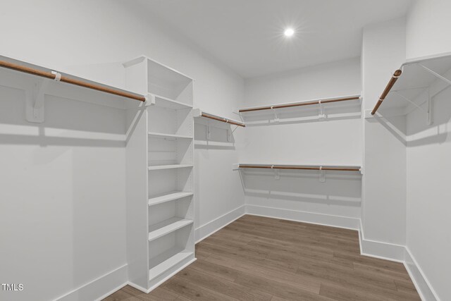248 Ashford Dr, Pittsboro, NC 27312 - walk in closet featuring wood finished floors