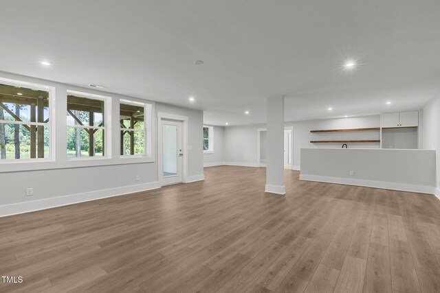 248 Ashford Dr, Pittsboro, NC 27312 - unfurnished living room featuring recessed lighting, light wood-style flooring, and baseboards