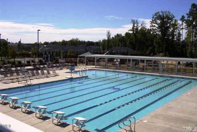 community pool featuring fence