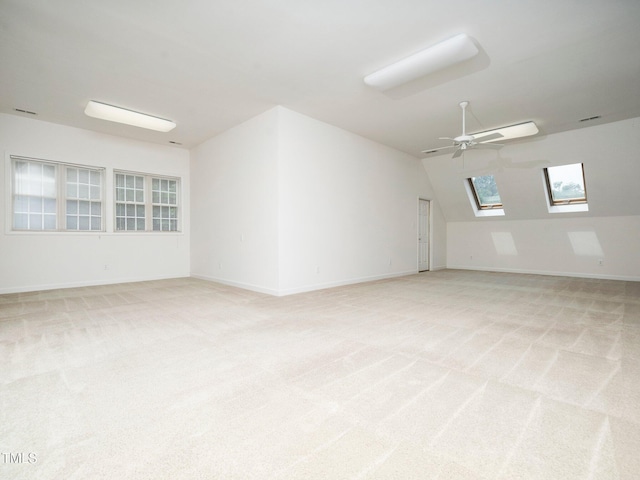 11221 Paddy Hollow Ln, Raleigh, NC 27614 - spare room with a skylight, light colored carpet, ceiling fan, and baseboards