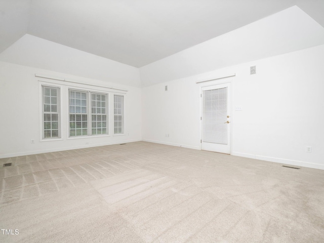 11221 Paddy Hollow Ln, Raleigh, NC 27614 - empty room with lofted ceiling, light carpet, and baseboards