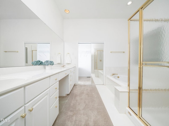 11221 Paddy Hollow Ln, Raleigh, NC 27614 - bathroom with a garden tub, a shower stall, double vanity, and recessed lighting