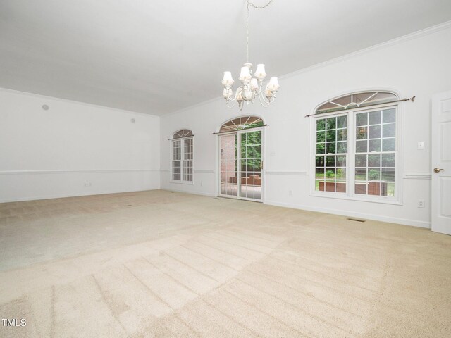 11221 Paddy Hollow Ln, Raleigh, NC 27614 - unfurnished room with a chandelier, crown molding, plenty of natural light, light colored carpet, and baseboards