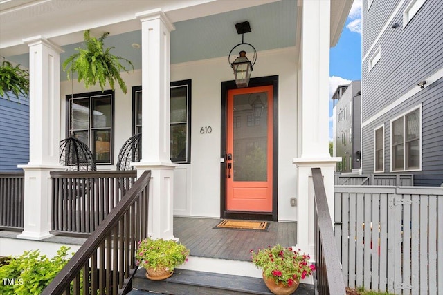 property entrance featuring covered porch