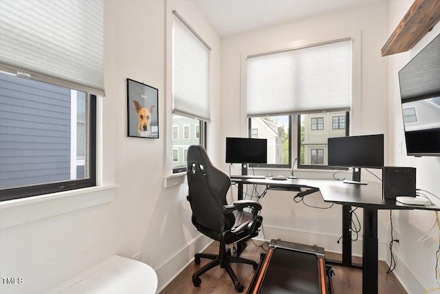 office area with wood finished floors and baseboards