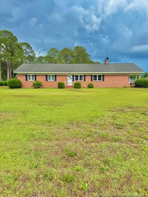 209 S Main St, Salemburg, NC 28385 - back of house with a yard