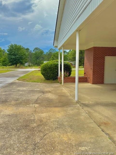 209 S Main St, Salemburg, NC 28385 - view of patio featuring driveway