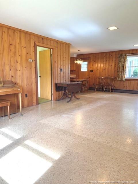 209 S Main St, Salemburg, NC 28385 - misc room featuring wooden walls and a chandelier