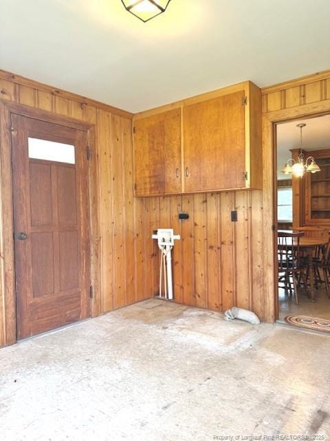 209 S Main St, Salemburg, NC 28385 - entryway featuring a chandelier and wooden walls