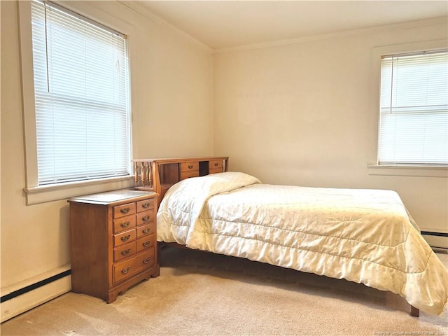 209 S Main St, Salemburg, NC 28385 - bedroom with baseboard heating, light carpet, and crown molding