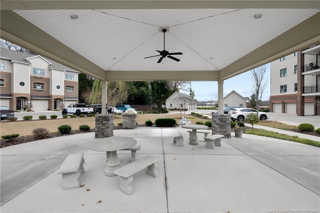 view of patio featuring a ceiling fan and a residential view