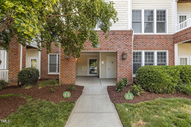 735 Portstewart Dr, Cary, NC 27519 - view of exterior entry featuring brick siding