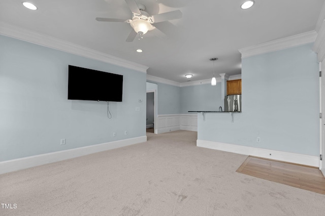 735 Portstewart Dr, Cary, NC 27519 - unfurnished living room with ornamental molding, light colored carpet, ceiling fan, recessed lighting, and baseboards