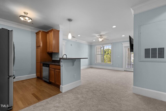 735 Portstewart Dr, Cary, NC 27519 - kitchen with appliances with stainless steel finishes, brown cabinets, crown molding, ceiling fan, and open floor plan